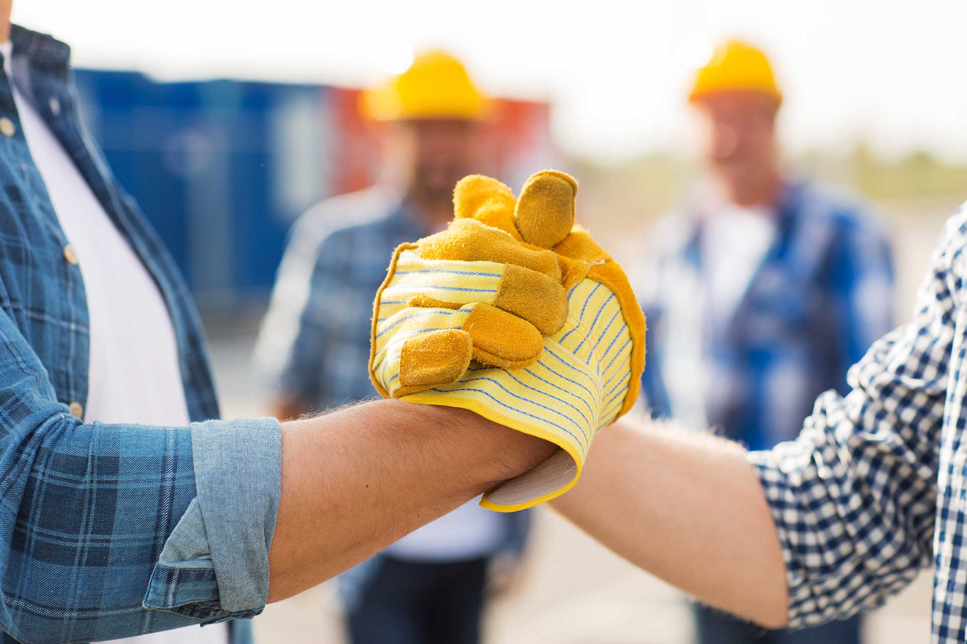 Handschlag Mitarbeiter Baustelle